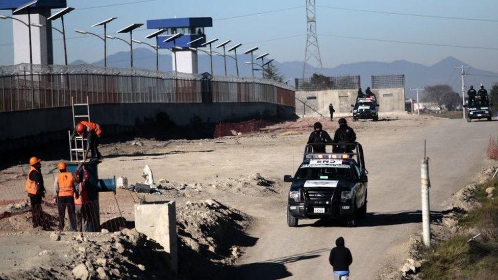 Federal Police officers patrol the surrounding of the Almoloya prison where drug kingpin Joaquin Guzman Loera "El Chapo Guzman" was readmitted on the eve, in Almoloya de Juarez, Mexico, on 9 January, 2016.