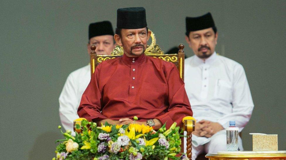 Brunei's Sultan Hassanal Bolkiah (C) attends an event in Bandar Seri Begawan on April 3, 2019