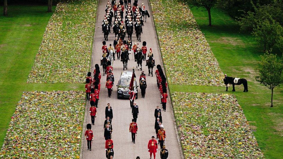 Emma and head groom Terry Pendry stand as the ceremonial procession passes