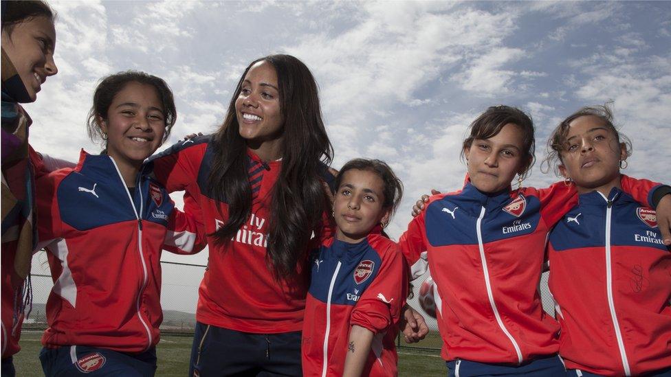 Alex Scott with some of the children