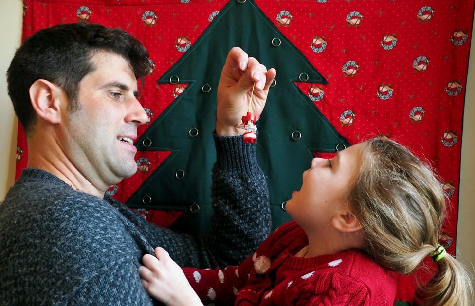 The author and his daughter in front of the advent calendar