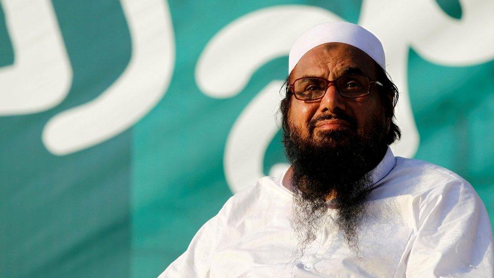 Hafiz Muhammad Saeed, chief of the banned Islamic charity Jamaat-ud-Dawa, looks over the crowed as they end a "Kashmir Caravan" from Lahore with a protest in Islamabad, Pakistan on 20 July 2016