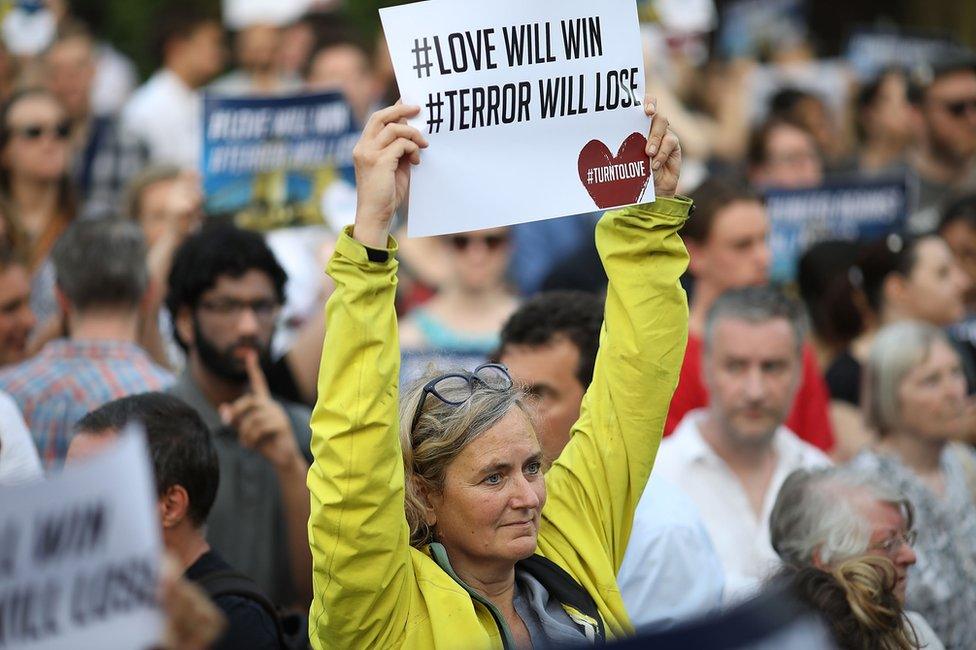 People attending a vigil