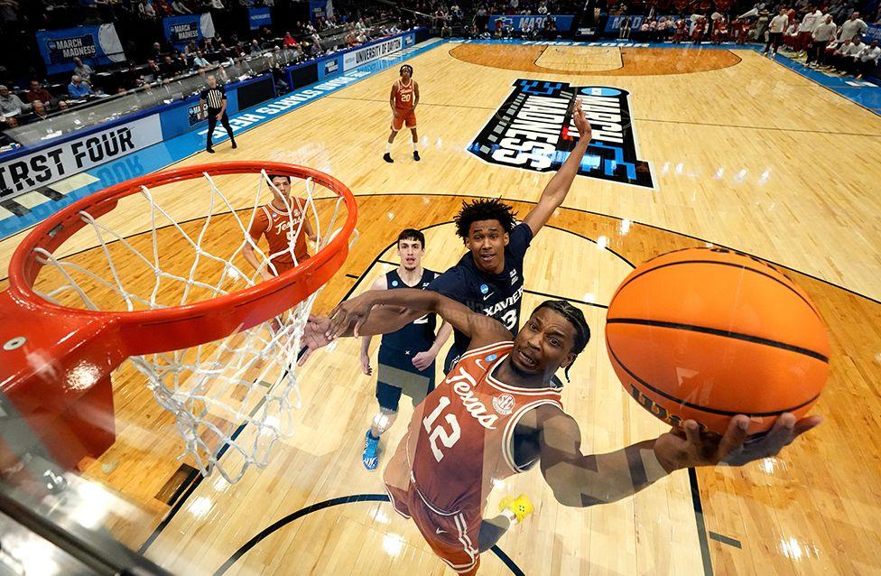 Tramon Mark of the Texas Longhorns shoots a layup against Dailyn Swain of the Xavier Musketeers during the first half in the NCAA Men's Basketball tournament at University of Dayton Arena on 19 March.