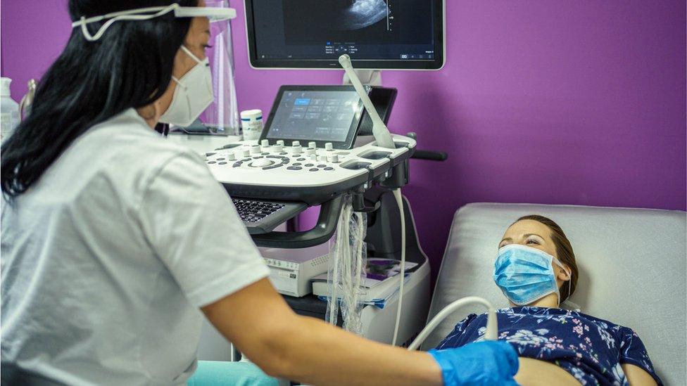 Pregnant woman having an ultrasound