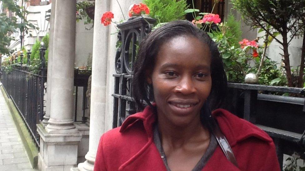 Joyce Aruga standing outside her hotel during the first 100 Women conference in London, 2013