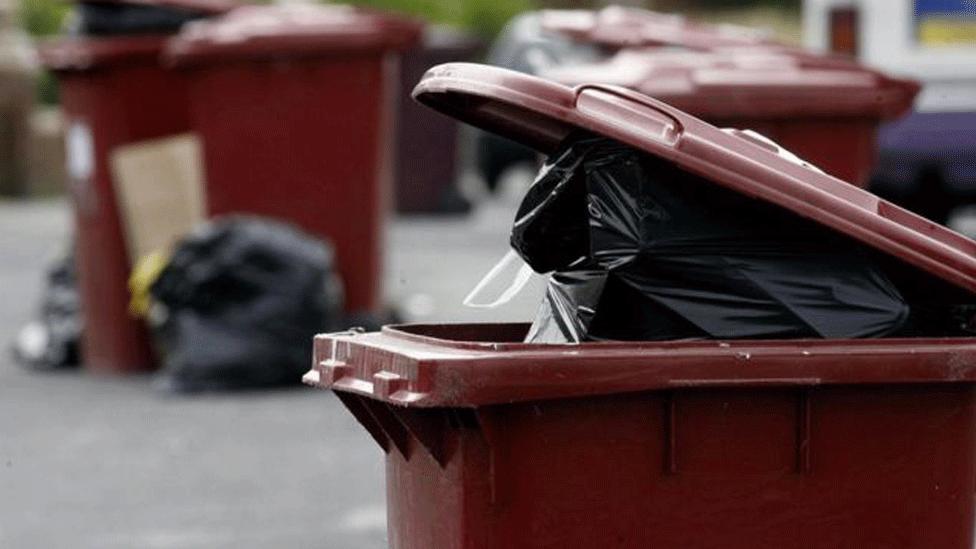 Full bins on kerb