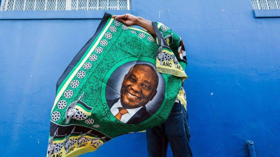 A street vendor sells goods depicting South African President Cyril Ramaphosa on 12 January 2019.