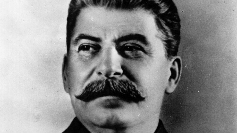 A black and white portrait of Joseph Stalin