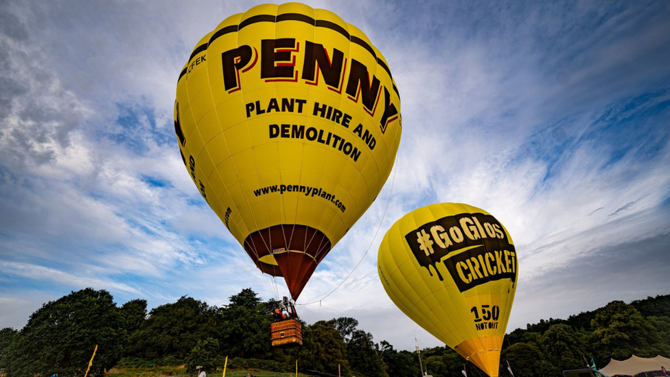 Two yellow hot air balloons