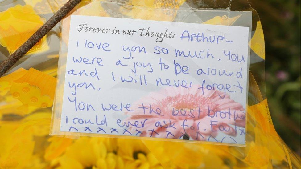 A floral tribute left by Arthur's twin brother, Earl