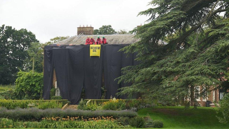 Greenpeace activists on the roof of Prime Minister Rishi Sunak's house