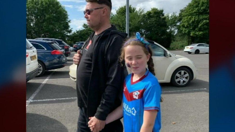 Dave with daughter Sydney wearing the shirt she was given for her eighth birthday