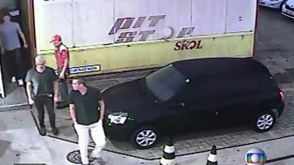 Still image from CCTV purports to show three US swimmers at a petrol station in Rio