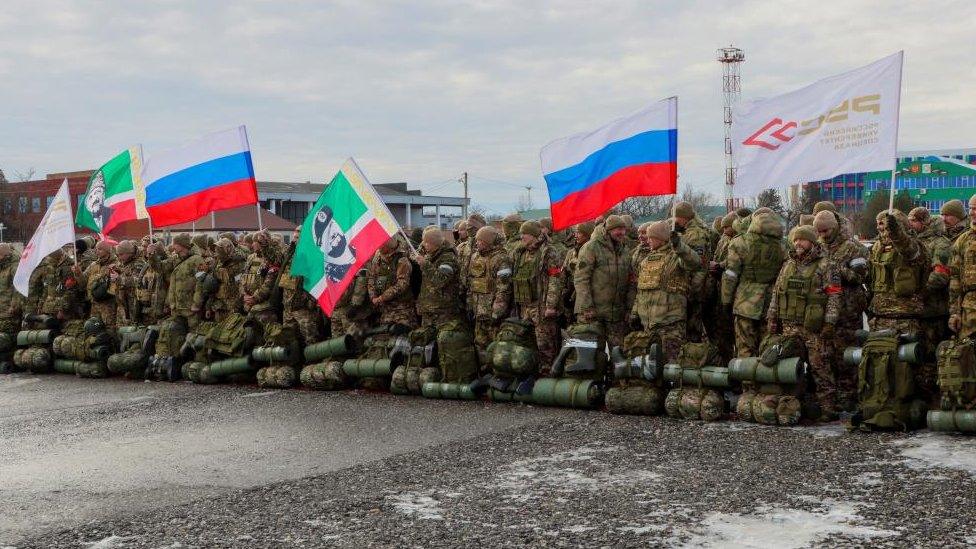 Volunteers, who joined the Russian armed forces and took military training in Chechnya, line up before departing for positions of the Akhmat battalion involved in Russia's military campaign in Ukraine, at an airport in Grozny, Russia, January 17, 2024