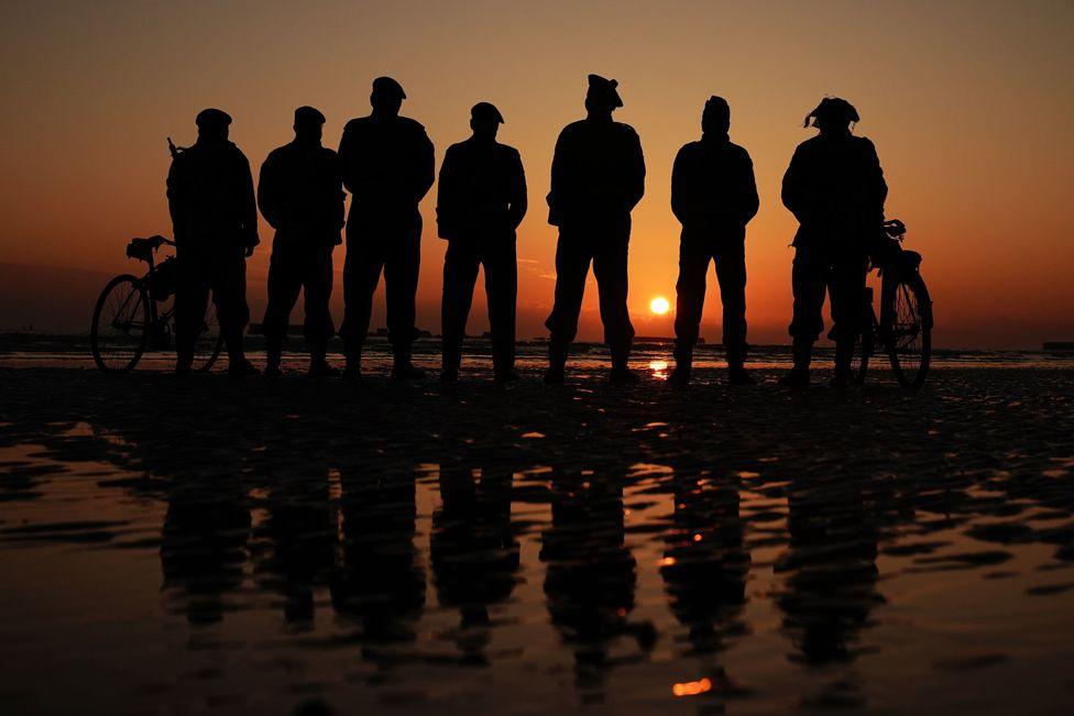 People attend the ceremony on Gold Beach in Arromanches in Normandy, France, to commemorate the 80th anniversary of the D-Day landings. June 6, 2024. 