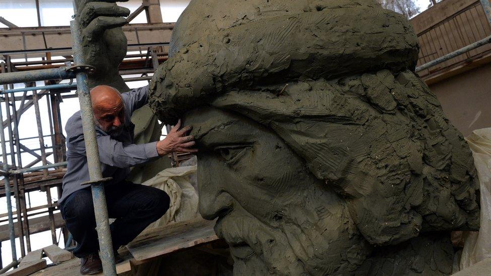 Russian sculptor Salavat Shcherbakov looking at a model for a monument to Vladimir the Great at his workshop in Moscow