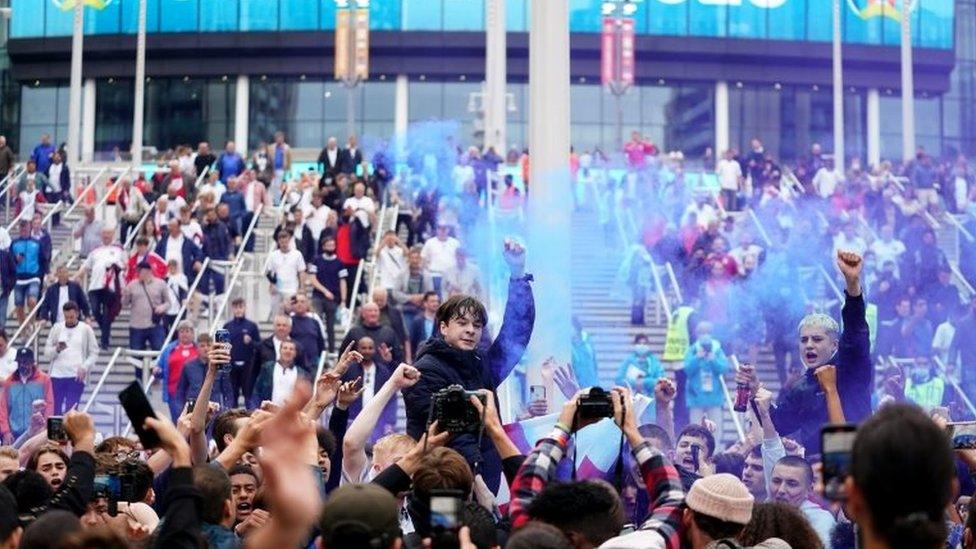 England fans celebrate victory following the UEFA Euro 2020 round of 16 match between England and Germany at the 4TheFans fan zone outside Wembley Stadium