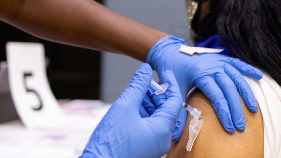 Woman receiving vaccine