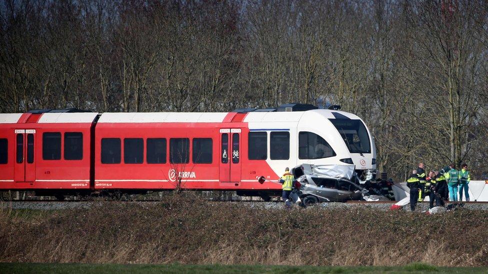 Emergency personnel work at the scene of a train crash on March 27, 2017 near Harlingen