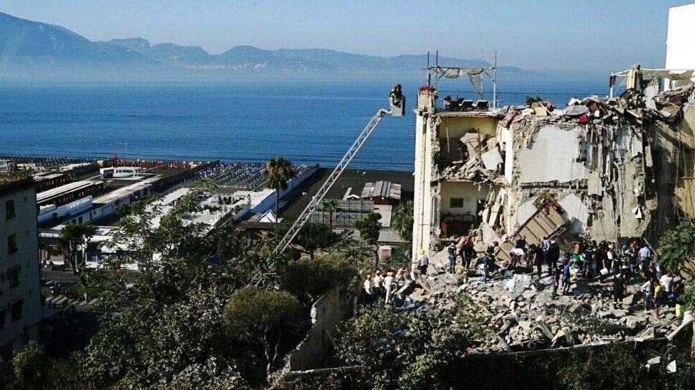 View of collapsed building by Bay of Naples, 7 Jul 17