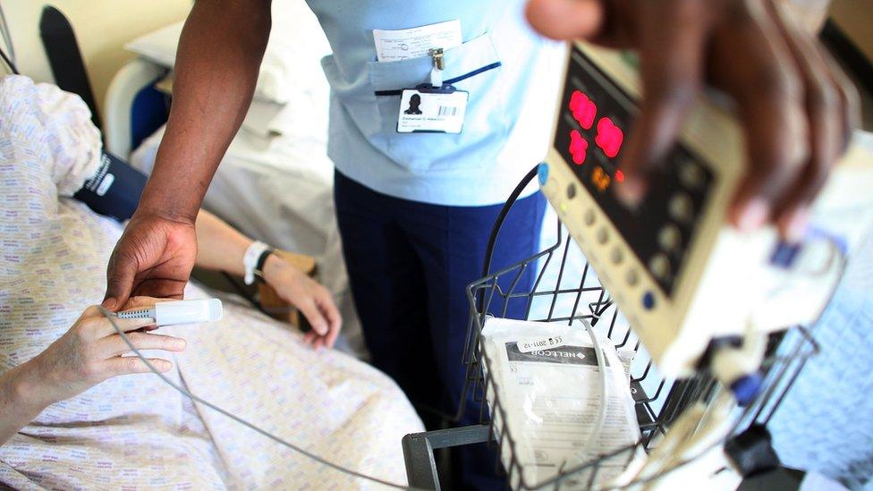 older person having heart tested by a nurse