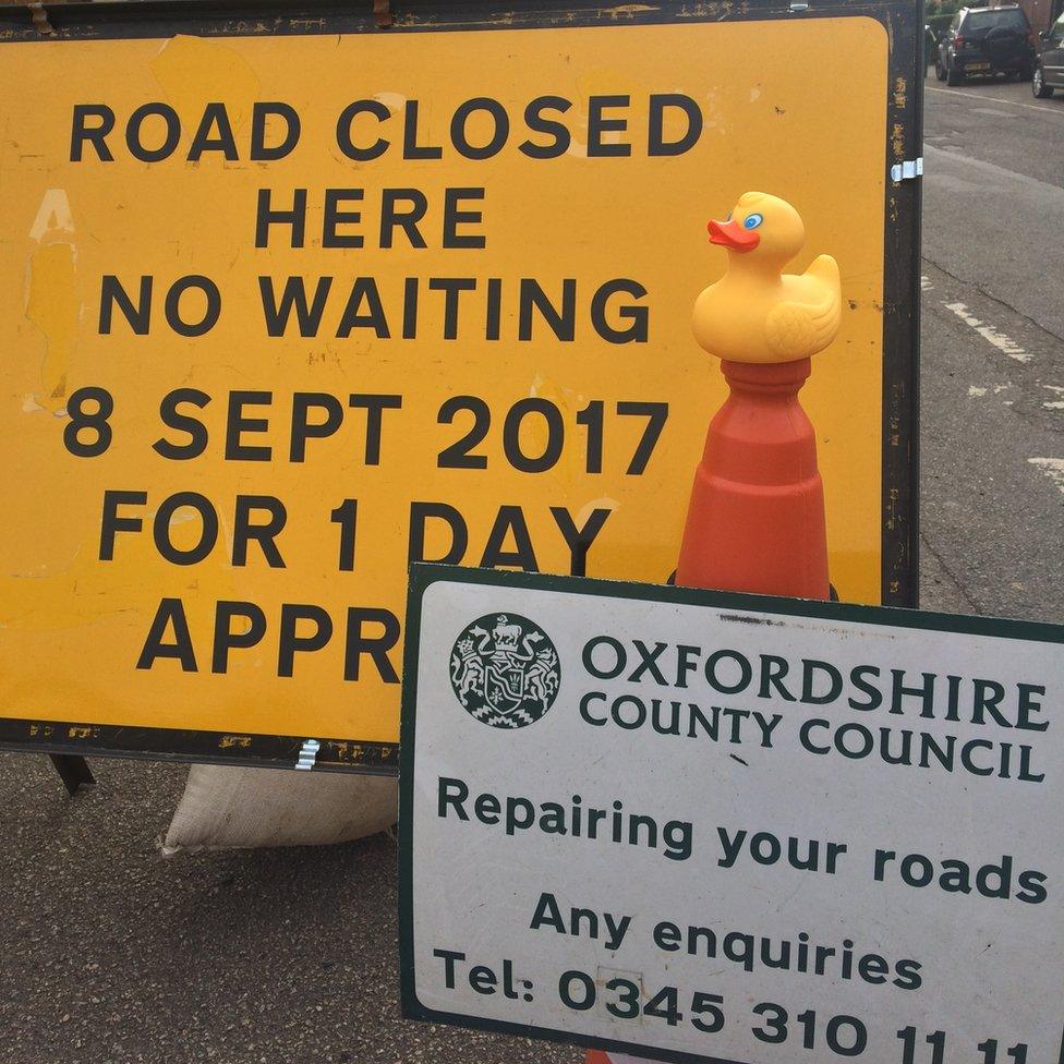 Road repair signs as Steeple Aston potholes repaired