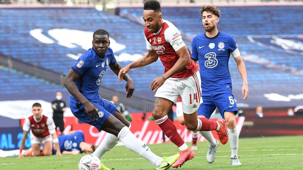 Pierre-Emerick Aubameyang beats Kurt Zouma of Chelsea to score his and Arsenal's 2nd goal during the FA Cup Final