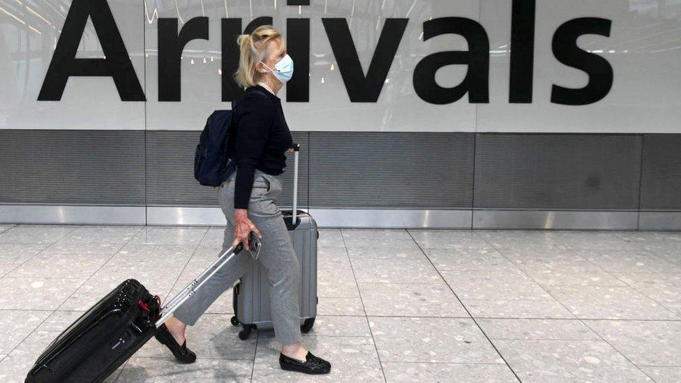 Woman arriving at Heathrow