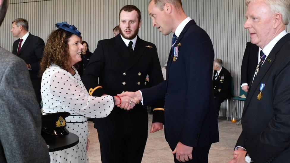 The Duke of Cambridge speaks with the family of Ian Molyneux