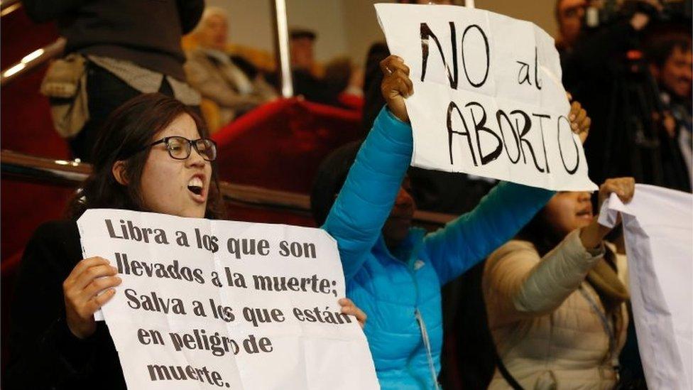 Demonstrators against abortion hold up placards that read "No to Abortion," rejecting the government"s bill to legalise abortion in certain cases, during a session at Chile"s Chamber of Deputies in Valparaiso, Chile August 2, 2017.