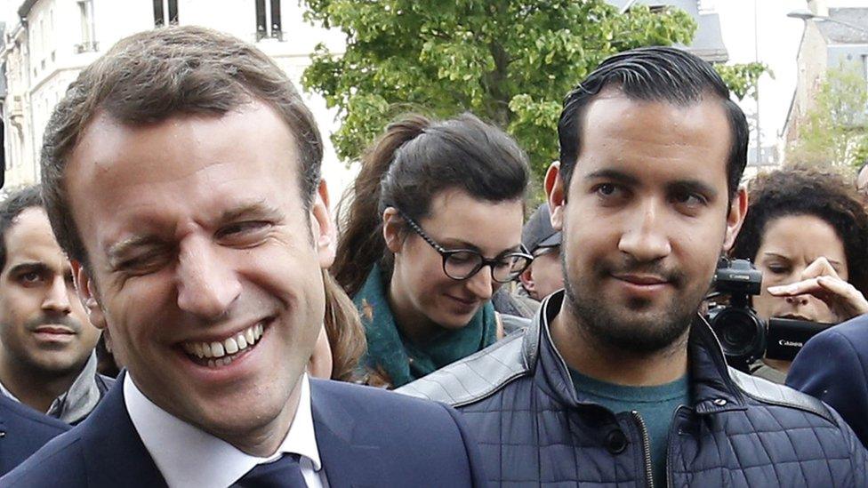 The then French presidential candidate Emmanuel Macron (C) of the "En Marche" political movement flanked by security staff Alexandre Benalla (R) during an election campaign visit in Rodez, France, 05 May 2017