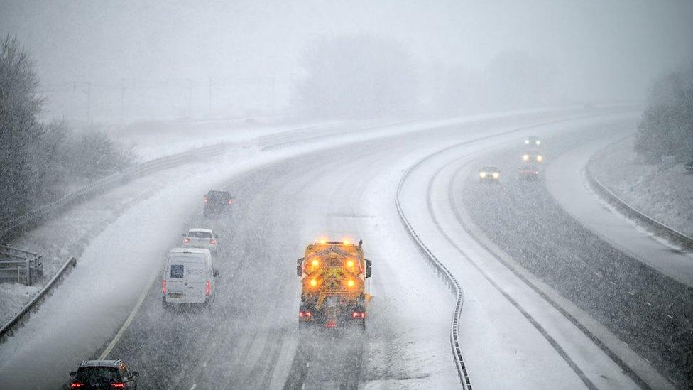 Gritters driving along the m74 in scotland