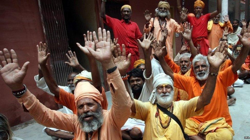 Indian Hindu holy men sit in queue for the registration to the Amarnath shrine pilgrimage at the registration centre in Jammu, the winter capital of Kashmir, India, 30 June 2015. The annual pilgrimage to a cave shrine housing a naturally formed icy stalagmite in a mountain cave 4 115 meters (13 500 feet) above sea level which attracts hundreds of thousands of Hindu pilgrims annually for two months in Indian Kashmir.