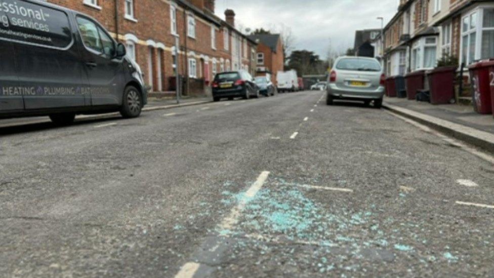 Broken glass in street