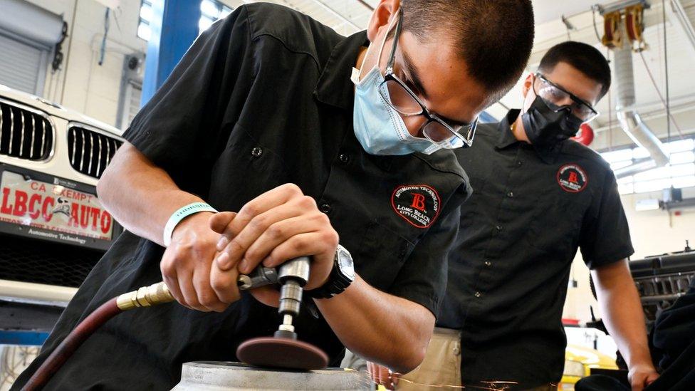 Hernan Galaviz cleans a brake disc brakes during auto technician class at LBCC Pacific Coast Campus in Long Beach on Thursday, November 4, 2021.