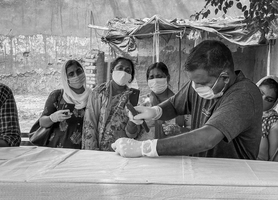 A coffin maker at work in Delhi