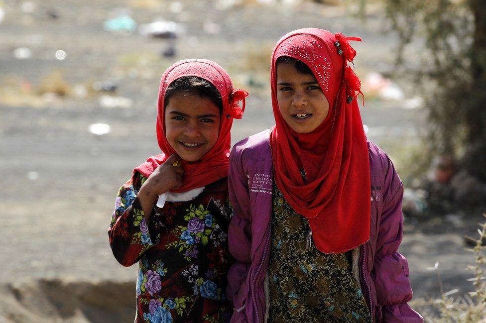 Two girls smile for the camera