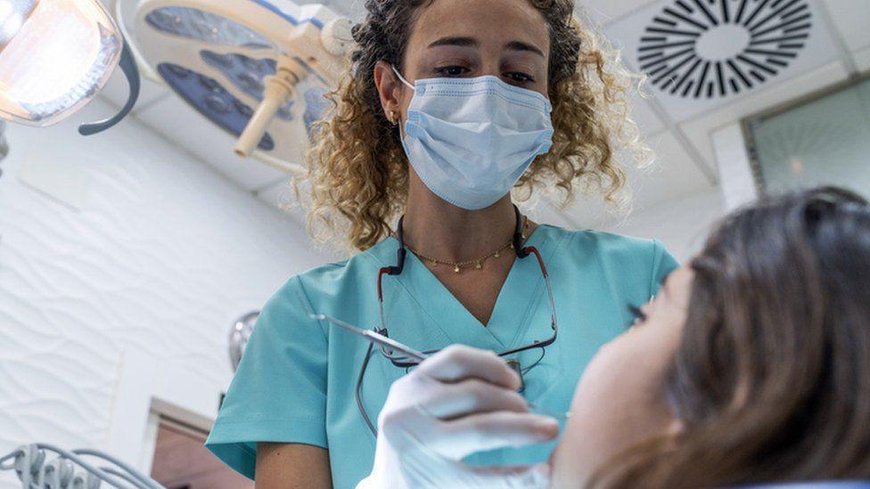 Dentist with patient