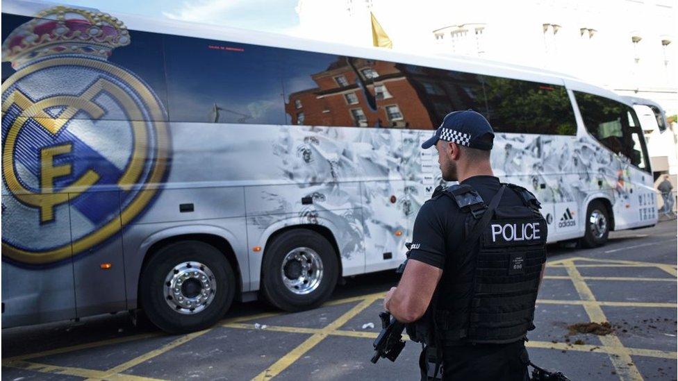 Policeman watches arrival of Real Madrid team bus in Cardiff in 2017