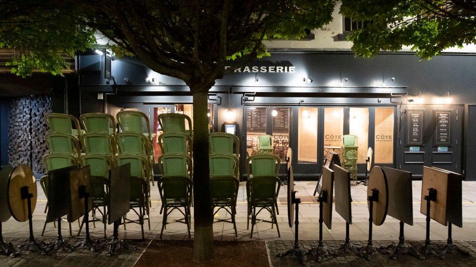 Cardiff's Mill Lane deserted with chairs outside a restaurant