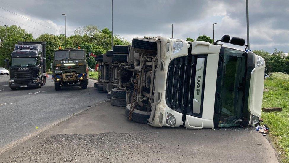 The lorry on its side