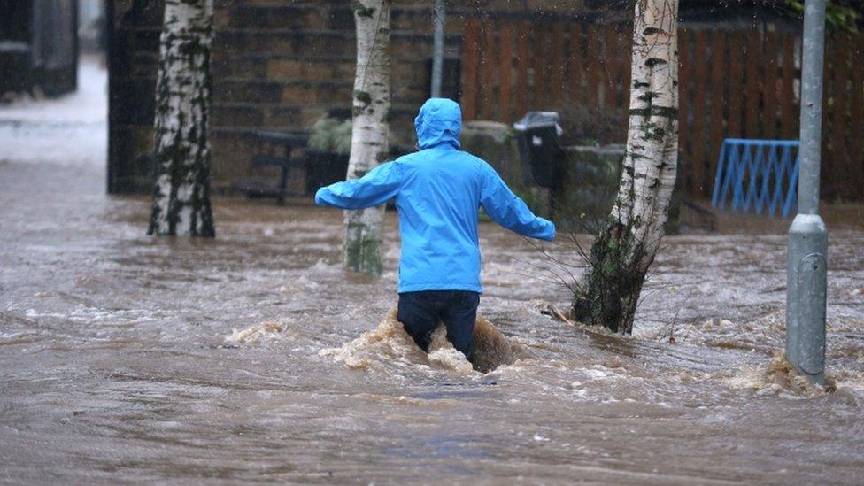 A person in flood water