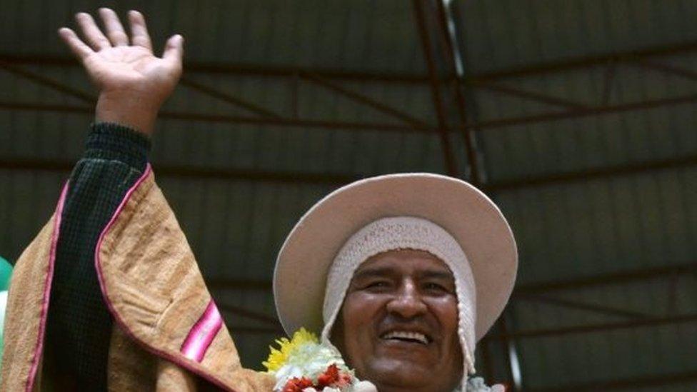 A handout picture made available by the Bolivian Information Agency (ABI) shows Bolivian President Evo Morales waving during a public event with indigenous people in Sica Sica municipality, 23 February 2016