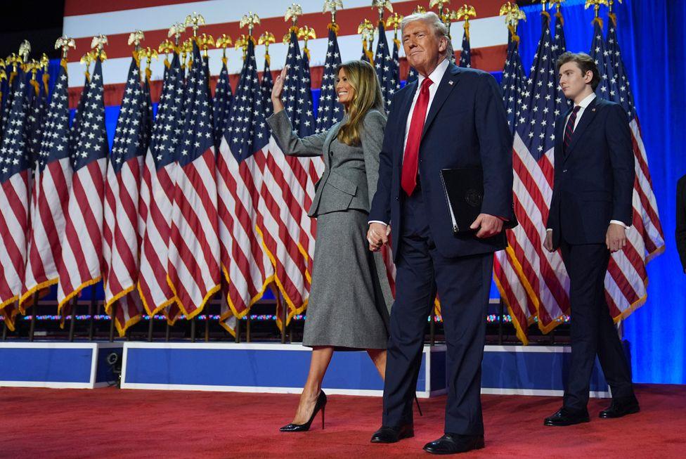 Republican presidential nominee former President Donald Trump, Melania Trump and Barron Trump, arrive to speaks at an election night watch party, Wednesday, Nov. 6, 2024, in West Palm Beach, Fla.