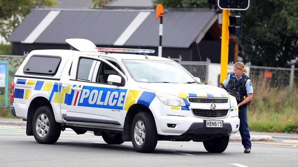 This picture released by Radio New Zealand shows a police officer cordoning a street near the mosque after a firing incident in Christchurch on March 15, 2019