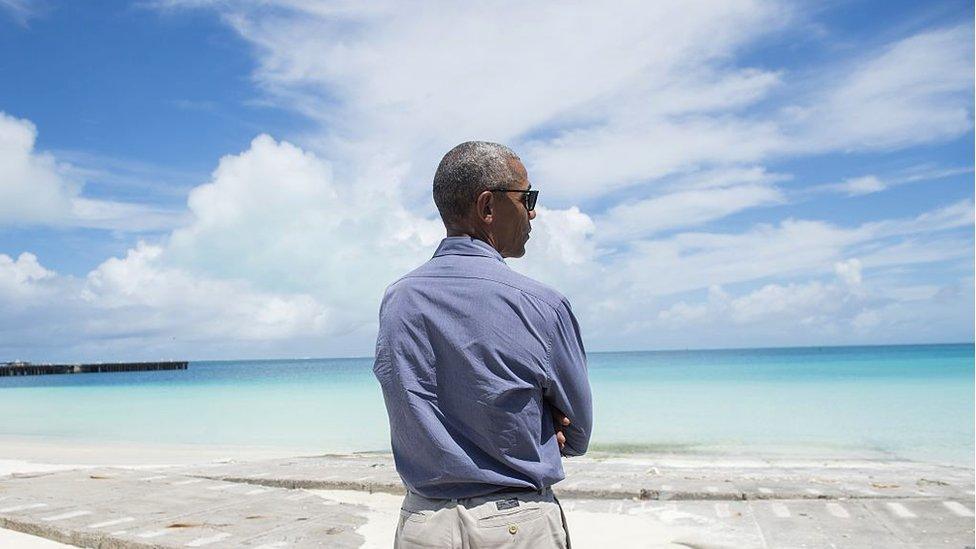 Obama looking out over the ocean