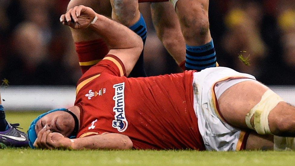 Justin Tipuric lies injured against Italy