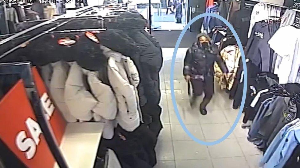 CCTV of Joshua Howell carrying a knife in a shop