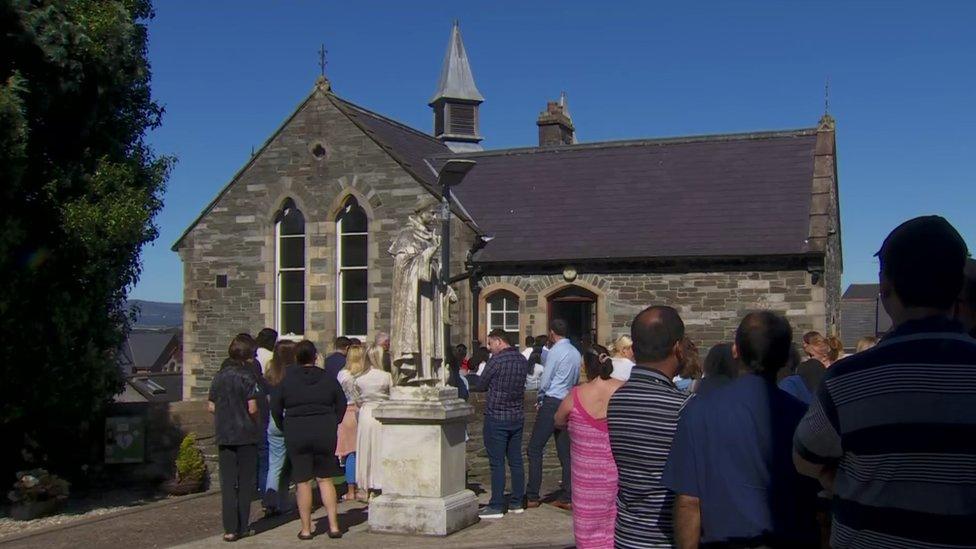 Mourners at St Columb's Church in the Waterside, Derry